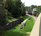 Erie Canal Lock No. 36 remains, with Lock E-17 in the background