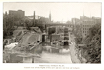 View of the flights of two new and five old locks at Lockport