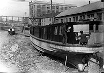 Dry docked canal boats being repaired