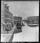 View along Erie Canal of Weighlock Building and warehouses