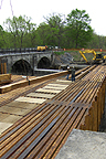 Nine Mile Creek Aqueduct restoration - Bottom timber being swung into place