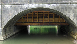 Nine Mile Creek Aqueduct restoration - View of the aqueduct trunk through
		  one of the arches