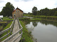 The museum building alongside the enlarged Erie Canal