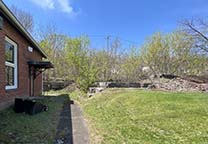 The remains of Enlarged Erie Canal Lock no. 11 behind the church