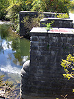 The narrow channel which feeds water to the canal, looking southwest